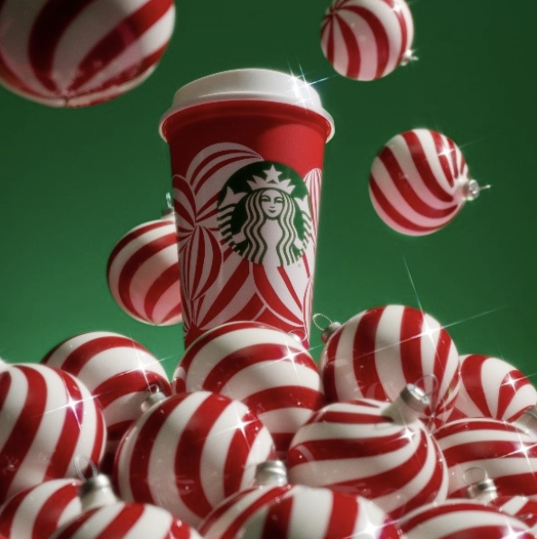 Image of Starbuck cup in bright Christmas color of white and red with green logo of Starbucks.