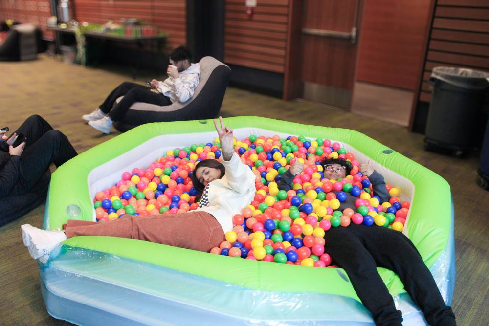Two students in a ball pit