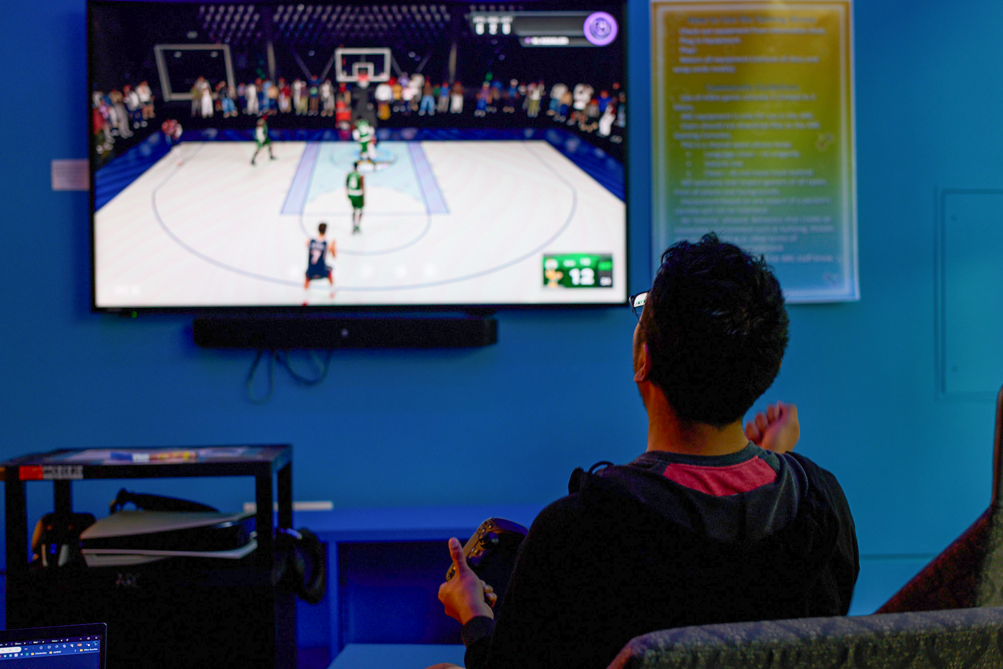 A student playing a basketball video game